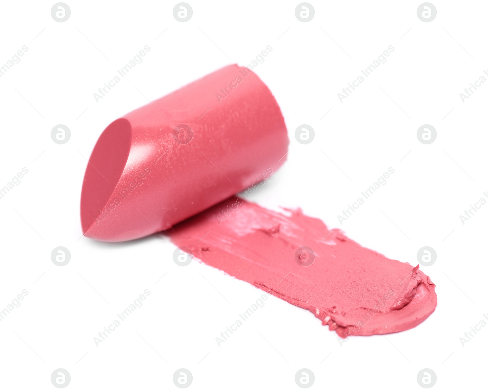 Photo of Bright lipstick and smear on white background