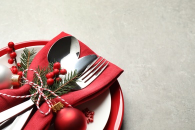 Photo of Beautiful Christmas table setting on light grey background. Space for text