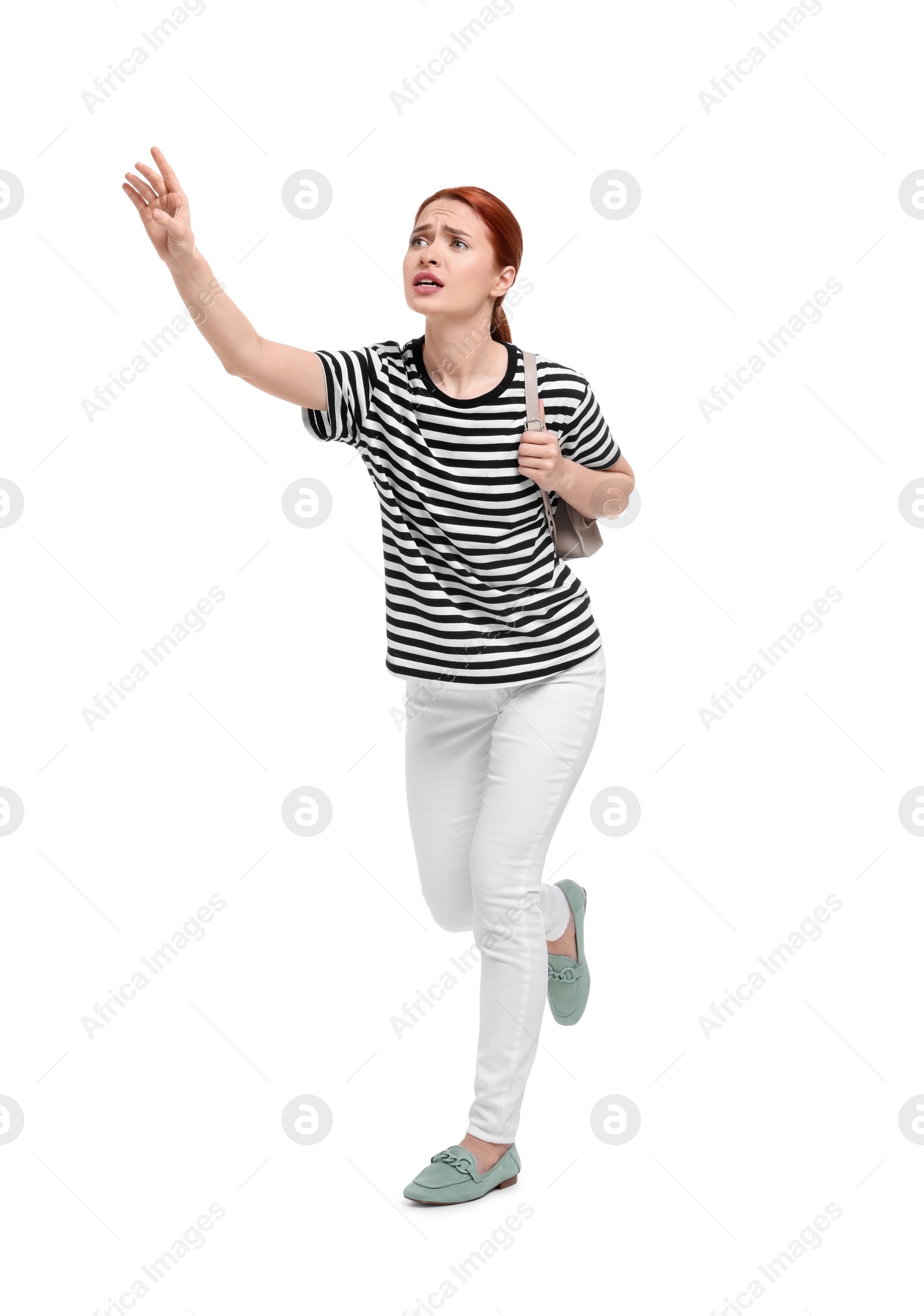 Photo of Worried woman with backpack on white background