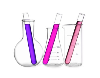 Glass flasks, beaker and test tubes with colorful liquids isolated on white