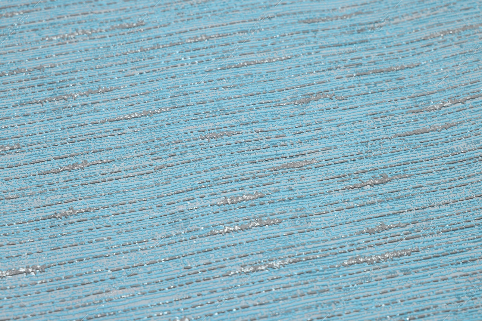 Photo of Stylish light blue wallpaper as background, closeup view