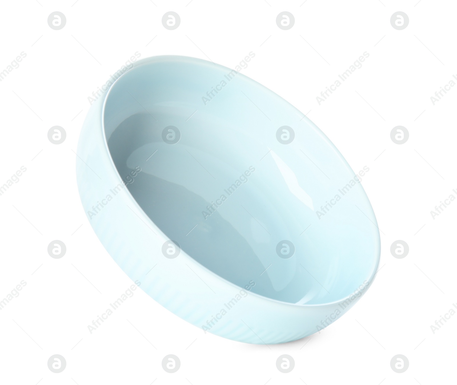 Photo of Clean light blue bowl isolated on white