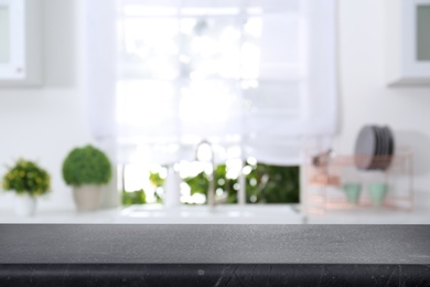 Image of Marble table in light kitchen. Space for design