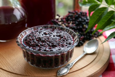 Photo of Elderberry jam and drink with Sambucus berries on table