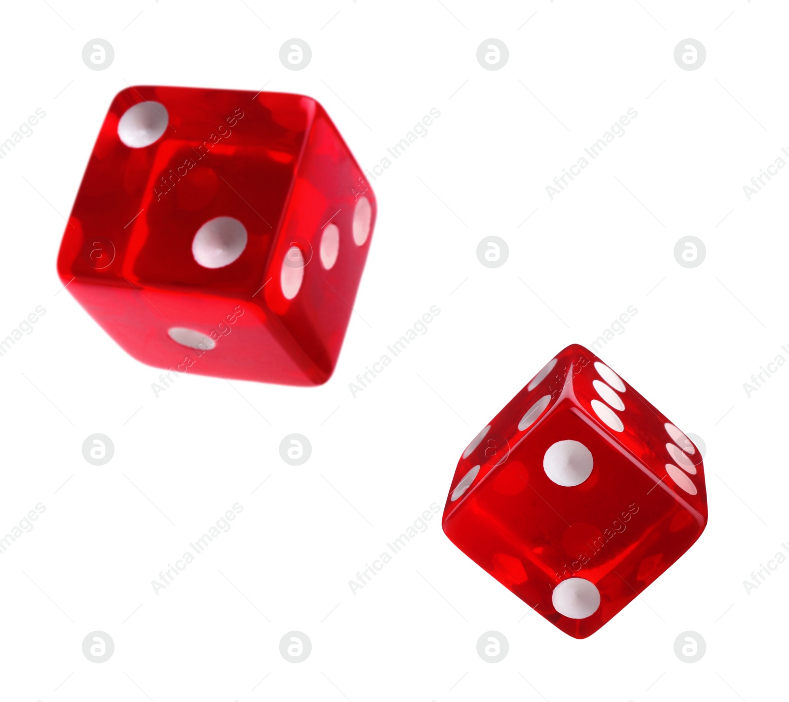 Image of Two red dice in air on white background