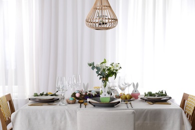 Beautiful Easter table setting with festive decor indoors