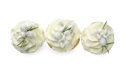 Tasty Easter cupcakes with vanilla cream isolated on white, top view