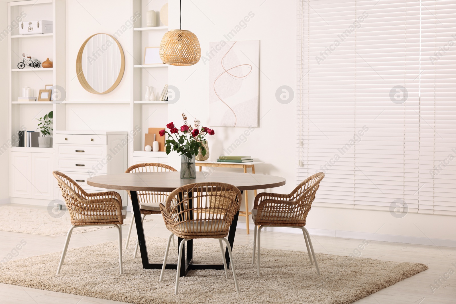 Photo of Stylish dining room interior with comfortable furniture. Space for text