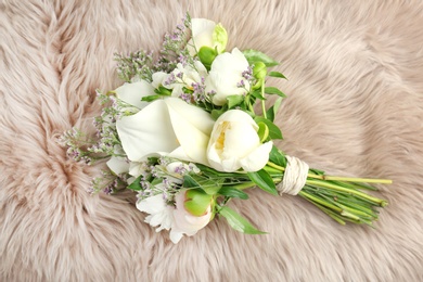 Photo of Bouquet of beautiful fragrant flowers on furry fabric