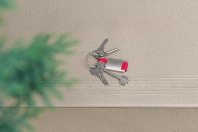 Keys on tiled staircase outdoors, above view. Lost and found