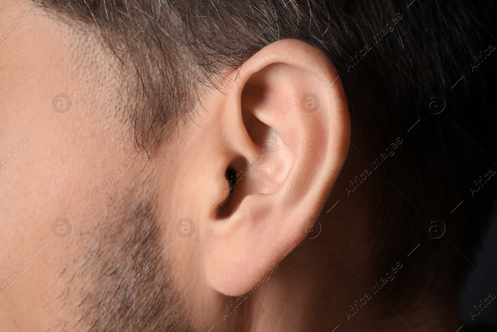 Photo of Closeup view of man, focus on ear