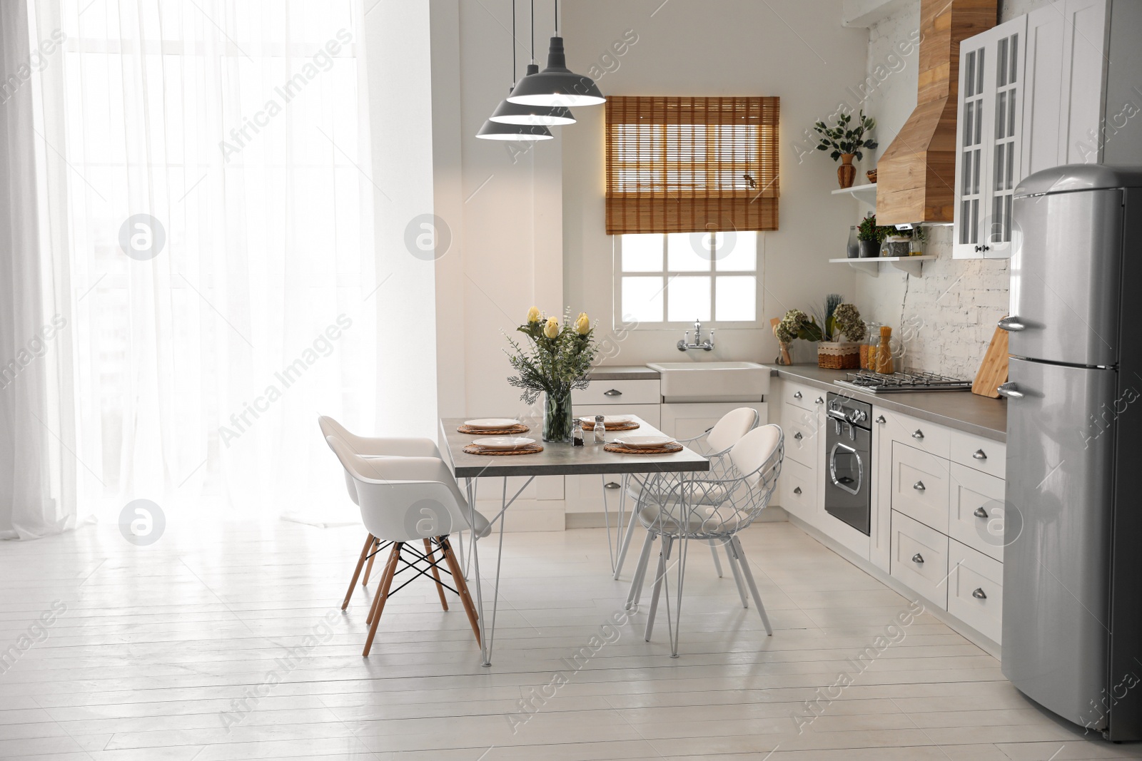 Photo of Beautiful kitchen interior with new stylish furniture