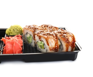 Box with tasty sushi rolls on white background. Food delivery