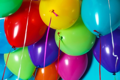 Photo of Bunch of bright balloons, closeup view. Festive decor