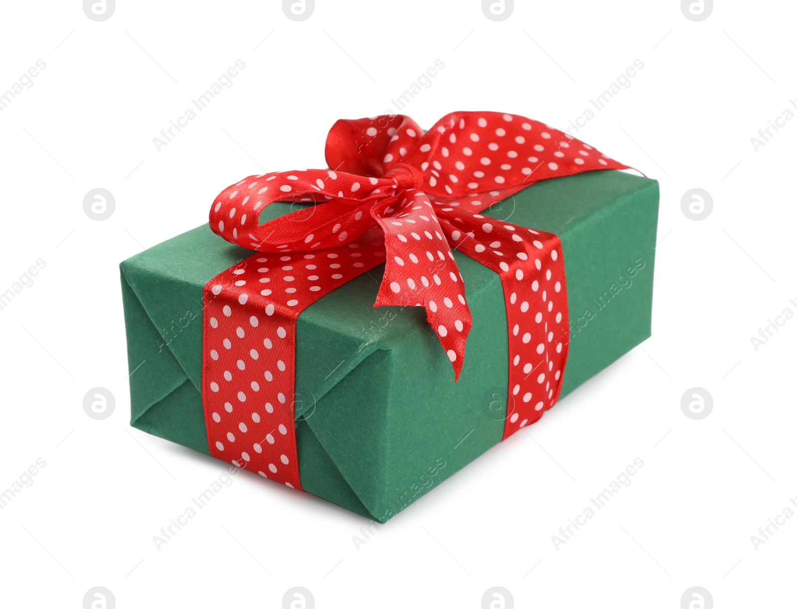 Photo of Christmas gift box decorated with red bow isolated on white