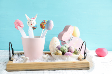 Photo of Different cake pops on table. Easter holiday