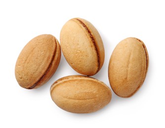 Photo of Delicious nut shaped cookie with boiled condensed milk on white background, top view