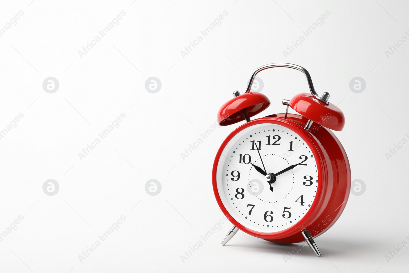 Photo of Alarm clock on white background. Time concept