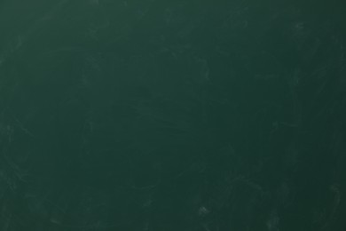 Dirty green chalkboard as background. School equipment