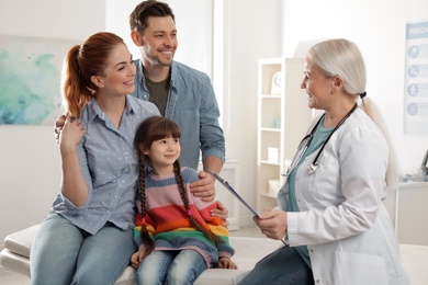 Family with child visiting doctor in hospital