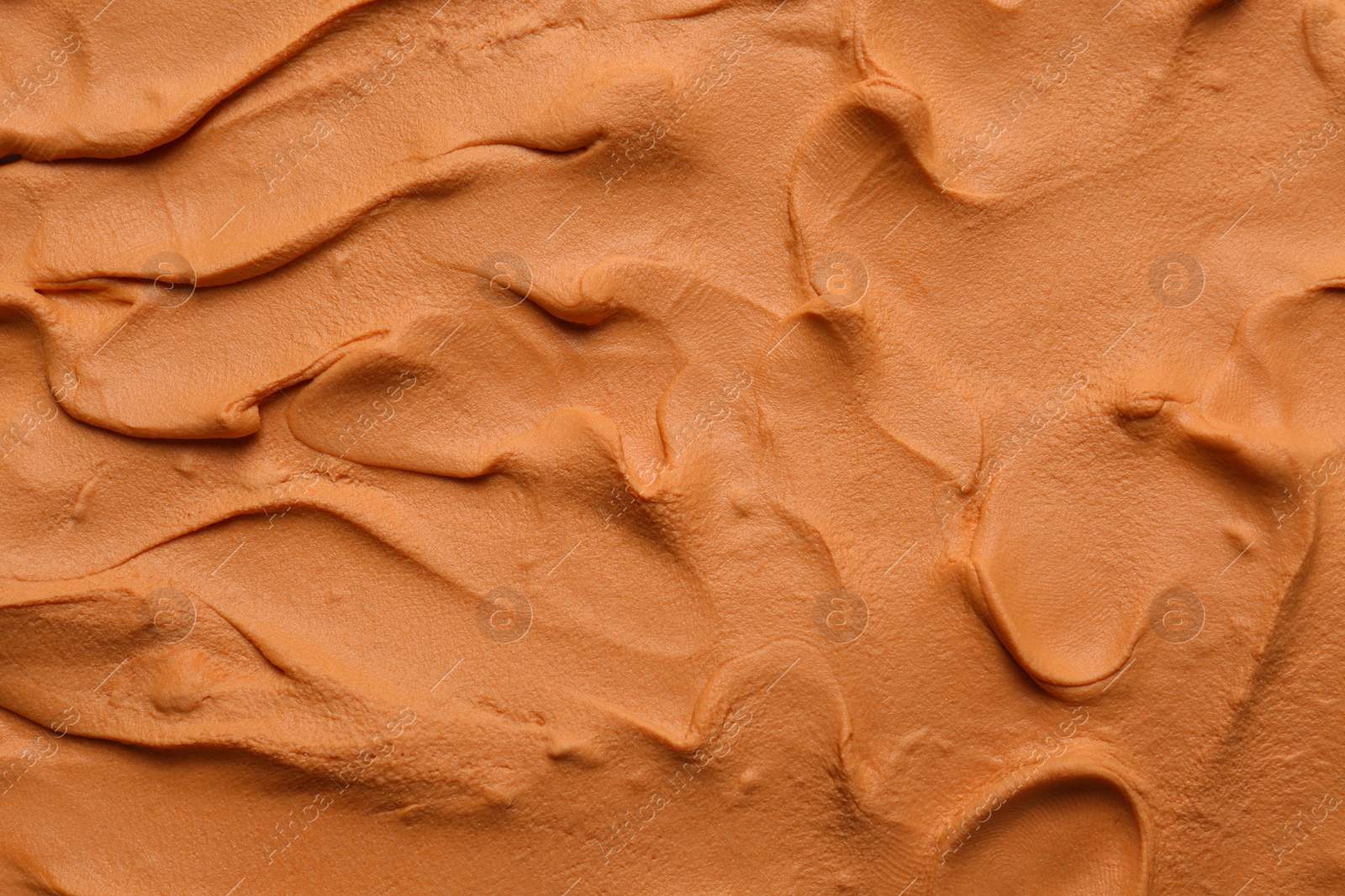 Photo of Brown play dough as background, top view