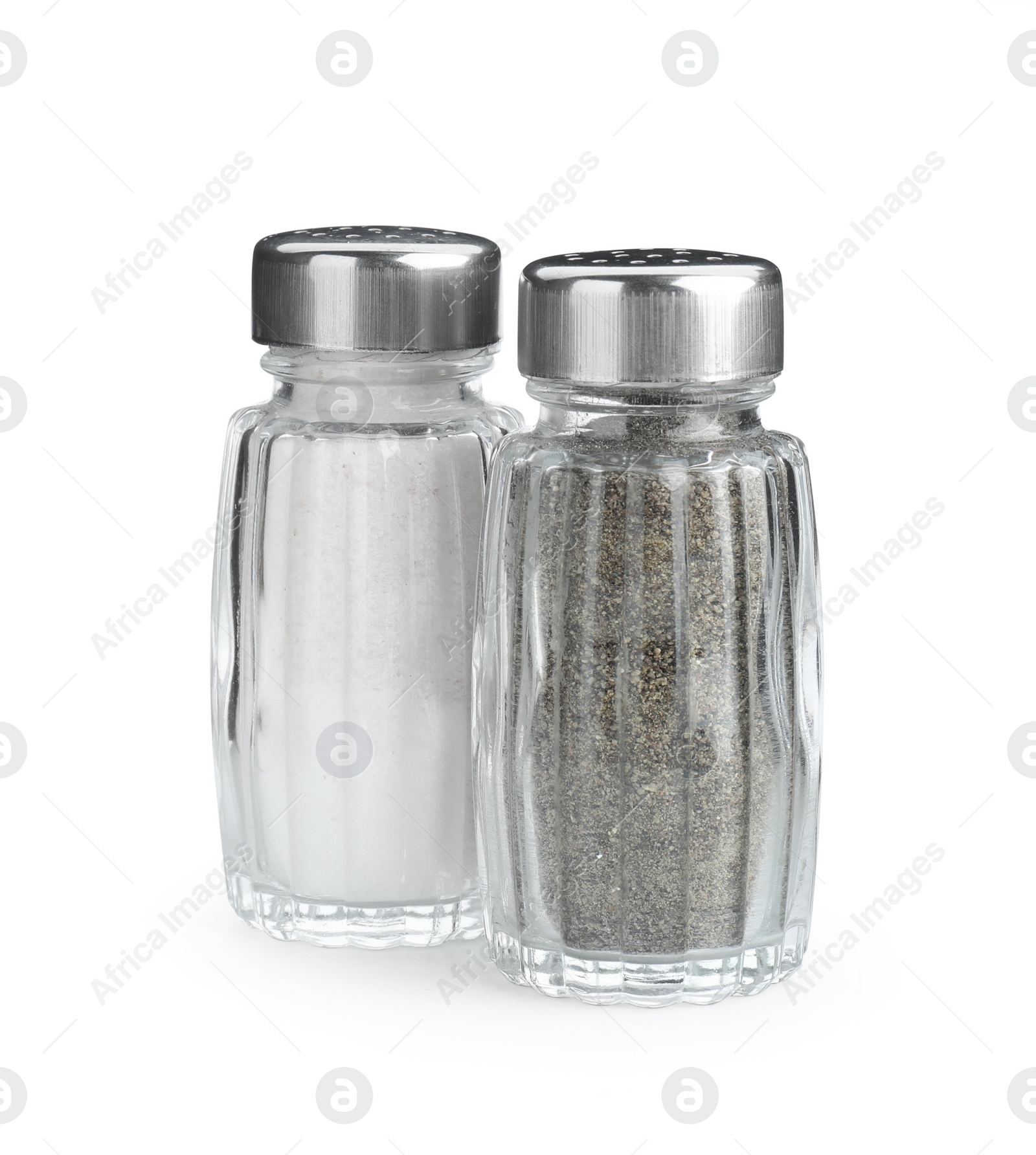 Photo of Salt and pepper shakers on white background