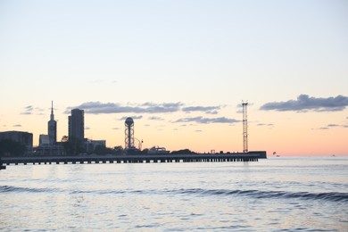 Mestia, Georgia - September 8, 2022: Picturesque view of sea pier under beautiful sky at sunset
