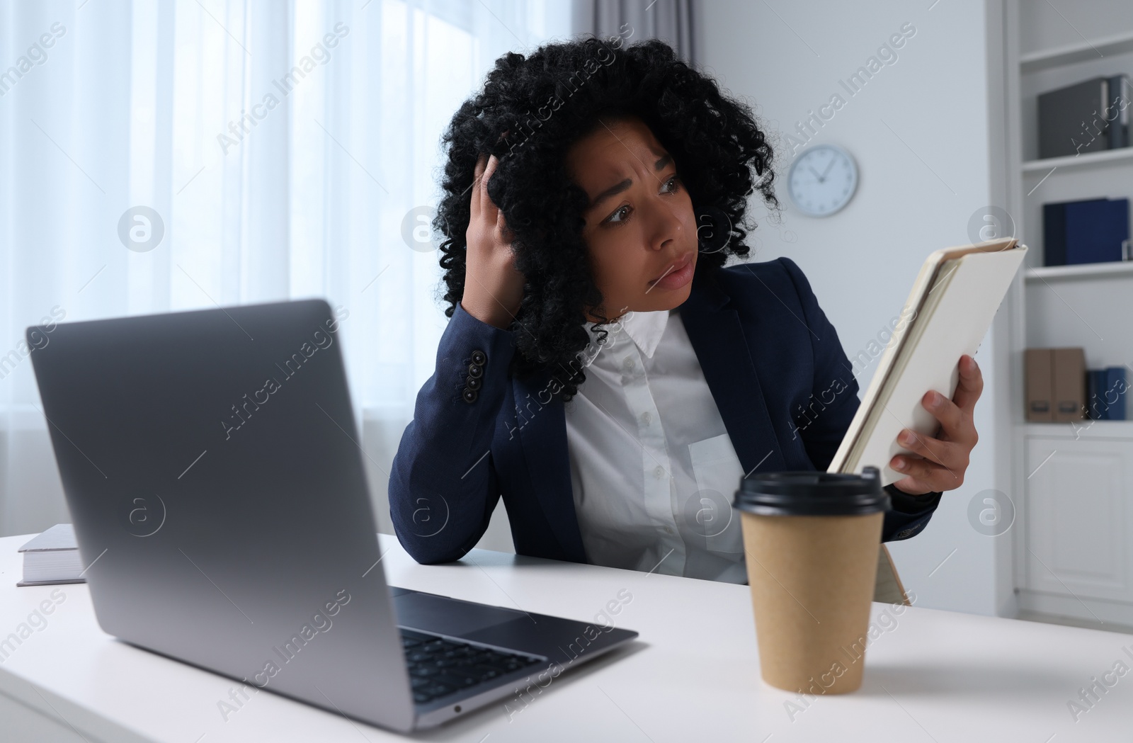 Photo of Deadline concept. Scared woman with notepad in office