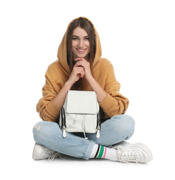 Beautiful young woman in casual outfit with stylish bag on white background