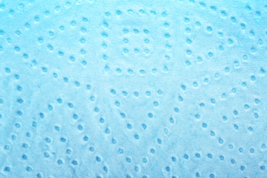 Photo of Perforated toilet paper as background, closeup. Personal hygiene