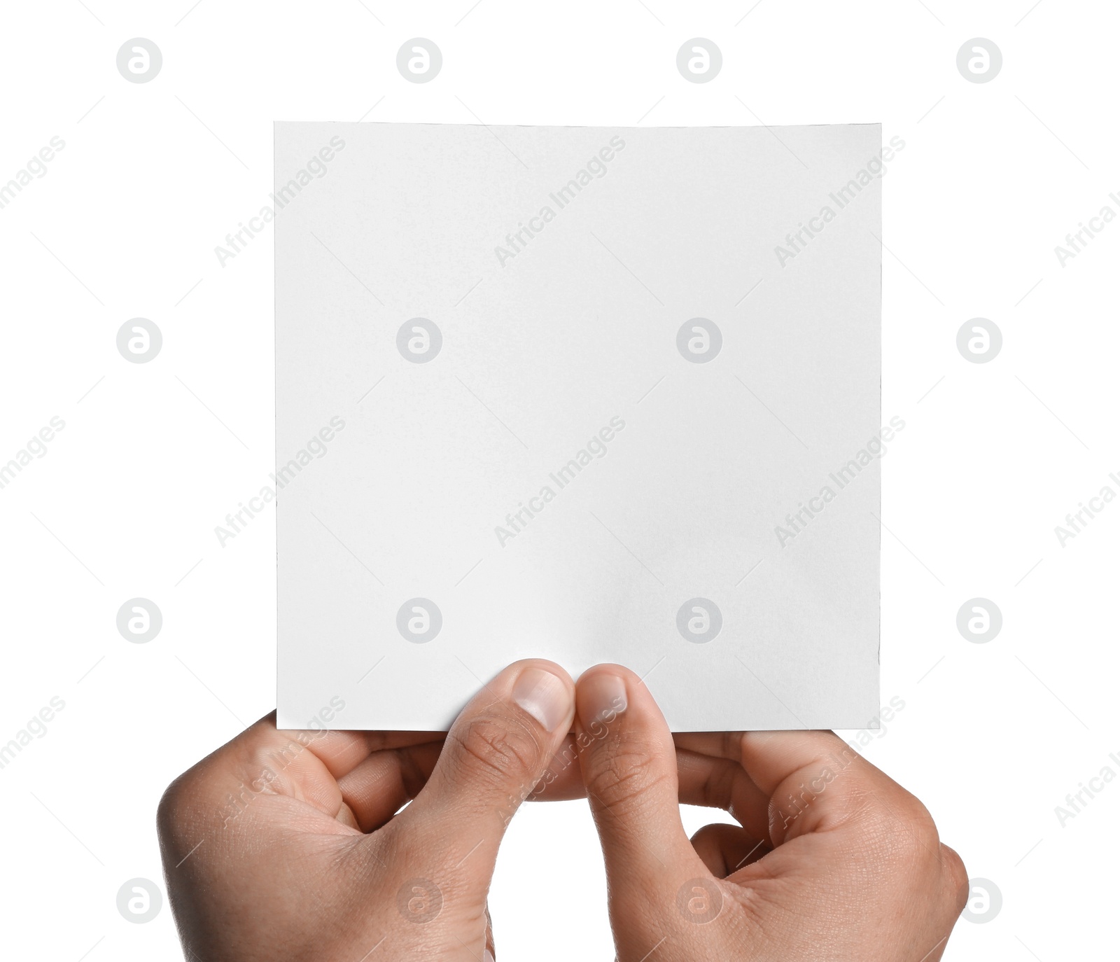 Photo of Man holding sheet of paper on white background, closeup. Mockup for design