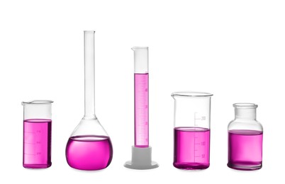 Laboratory glassware with pink liquid isolated on white
