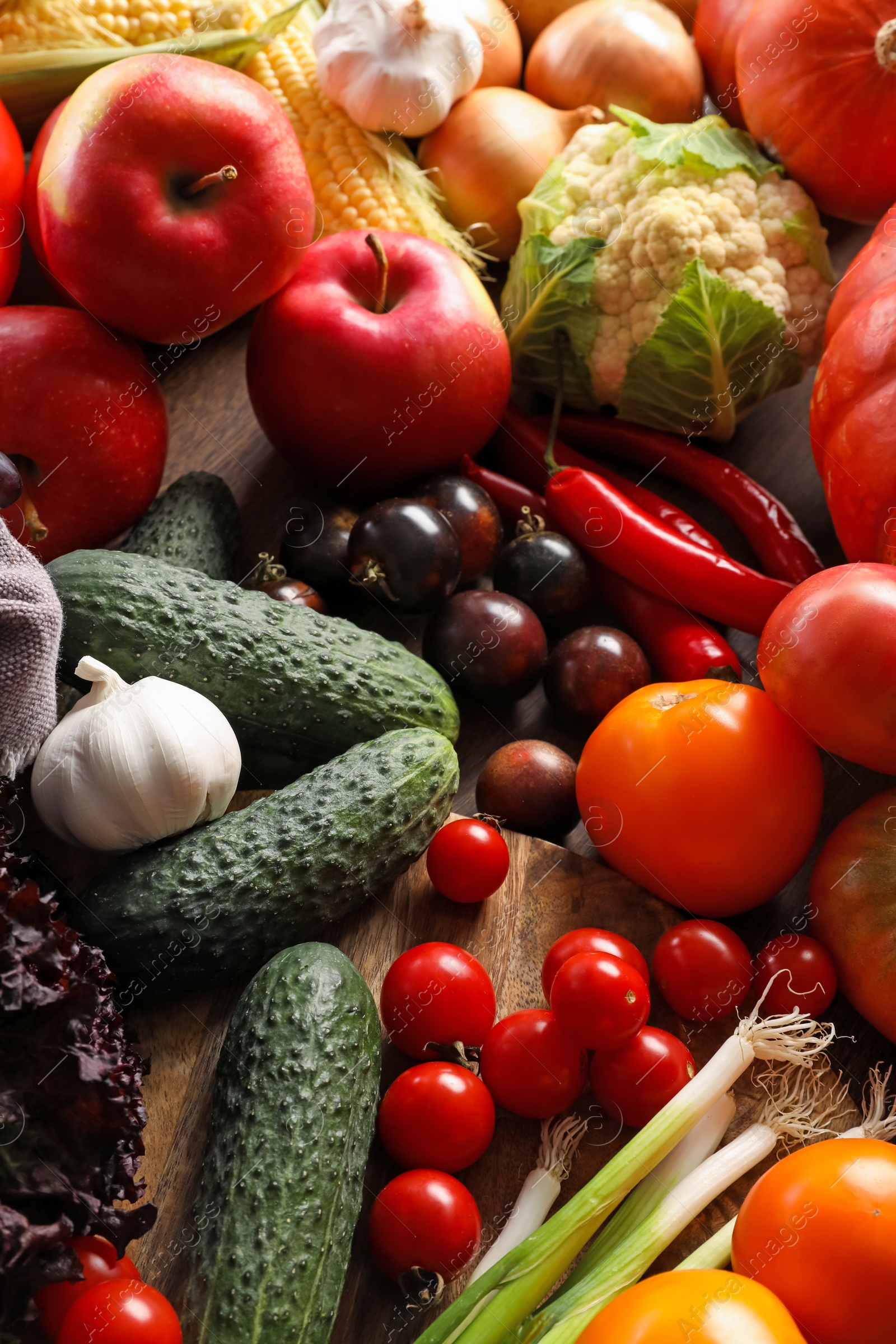 Photo of Different fresh ripe vegetables and fruits on wooden table, above view