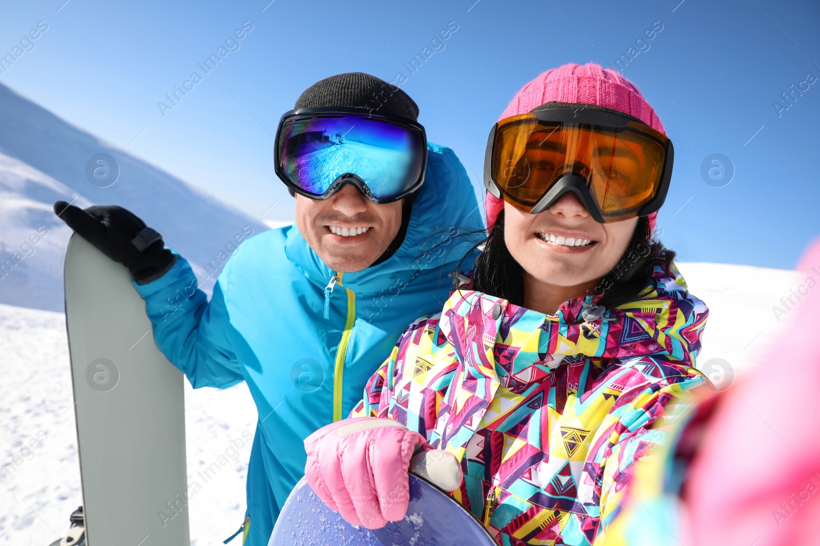 Photo of Couple taking selfie on hill. Winter vacation