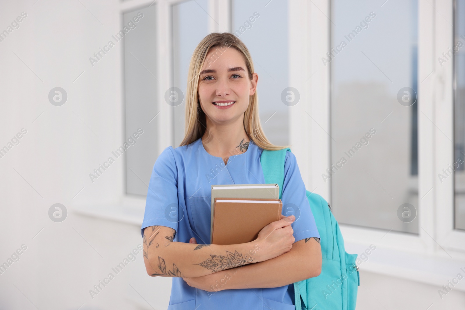 Photo of Portrait of young intern wearing uniform in university hall