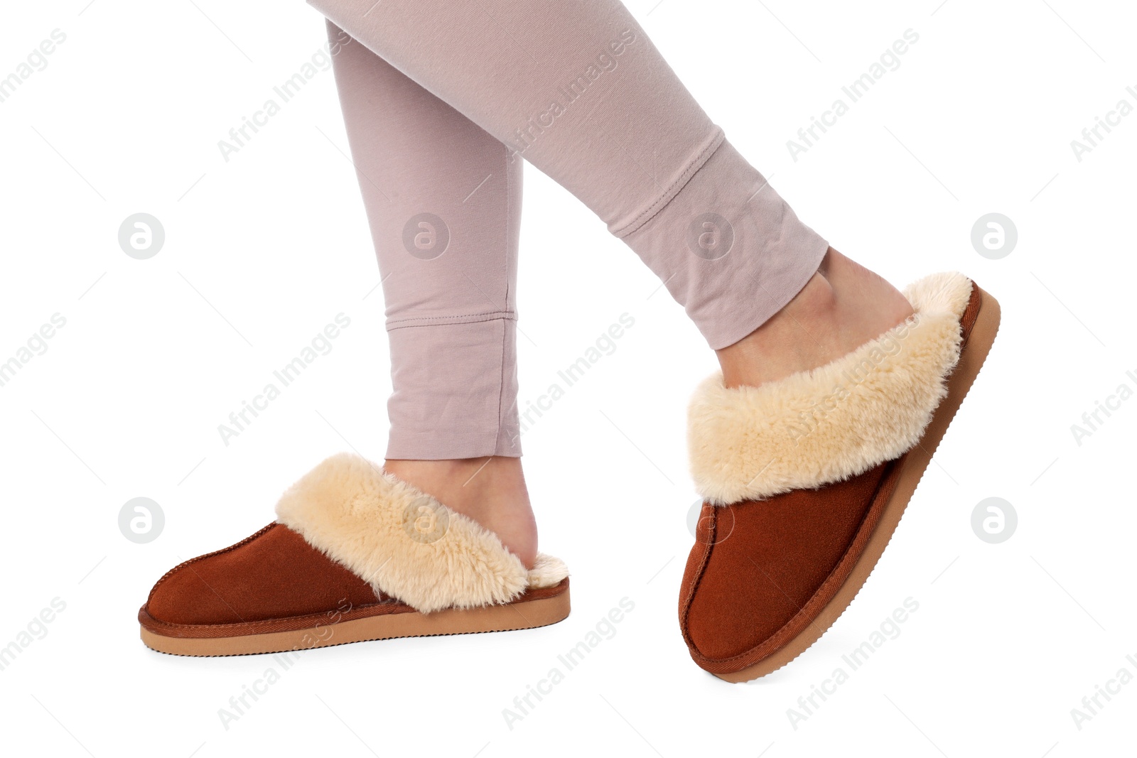 Photo of Woman in soft slippers on white background, closeup