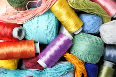 Photo of Different sewing threads as background