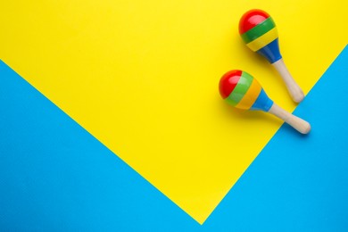 Photo of Maracas on colorful background, flat lay with space for text. Musical instrument