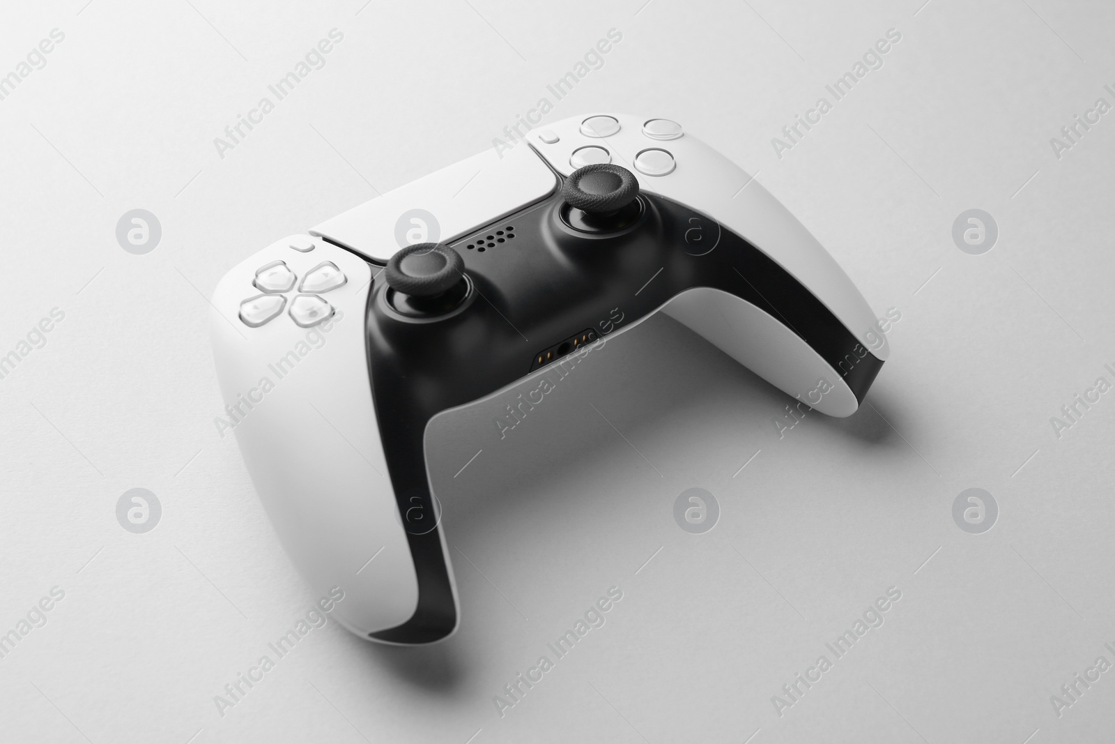 Photo of Wireless game controller on light grey background