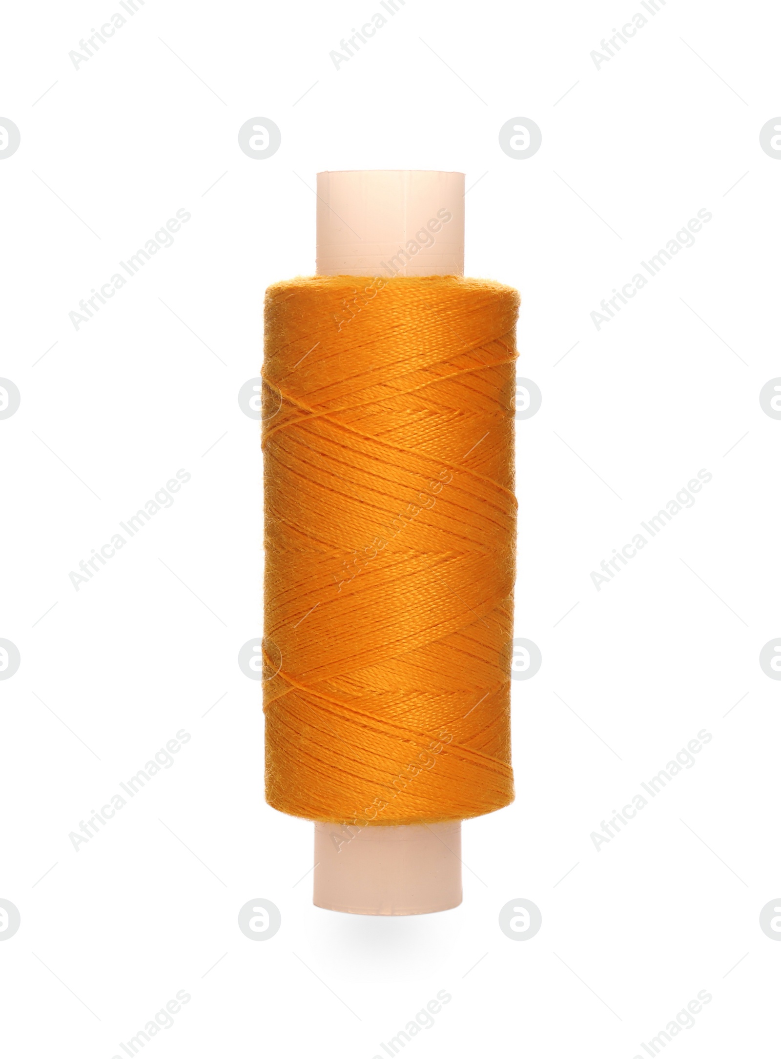 Photo of Spool of orange sewing thread isolated on white