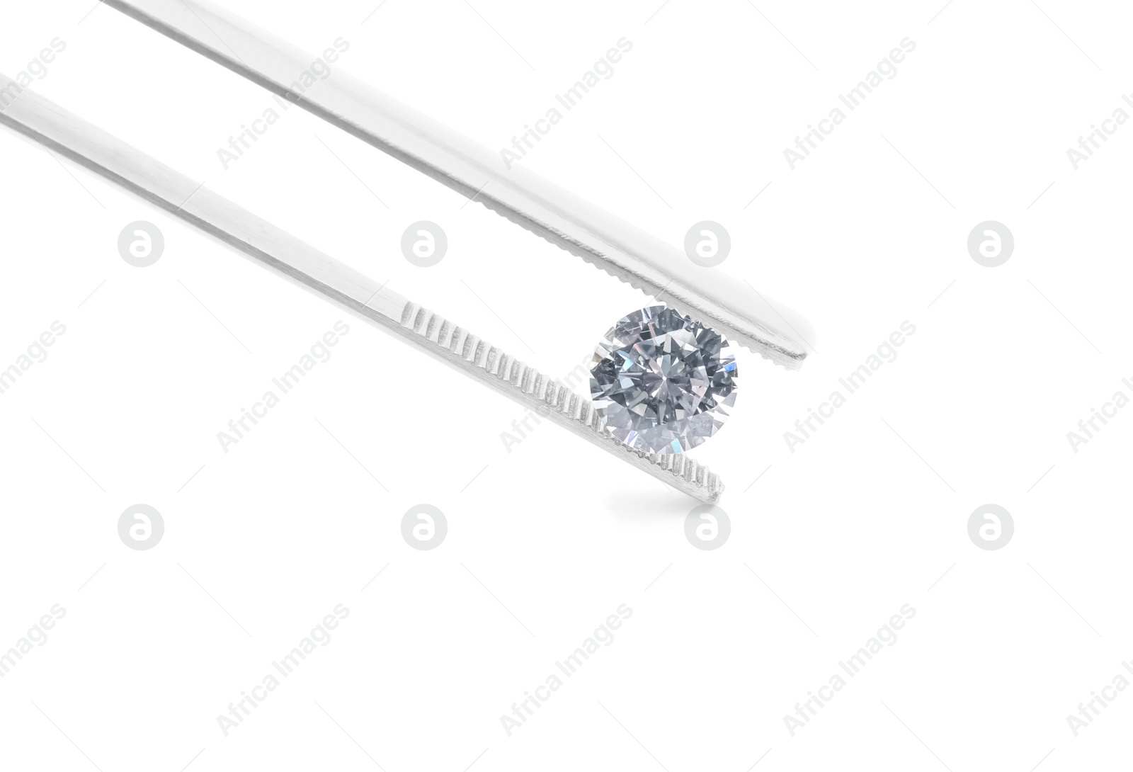 Photo of Tweezers with beautiful shiny diamond isolated on white