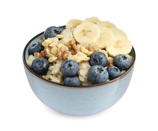 Tasty oatmeal with banana, blueberries and walnuts in bowl isolated on white