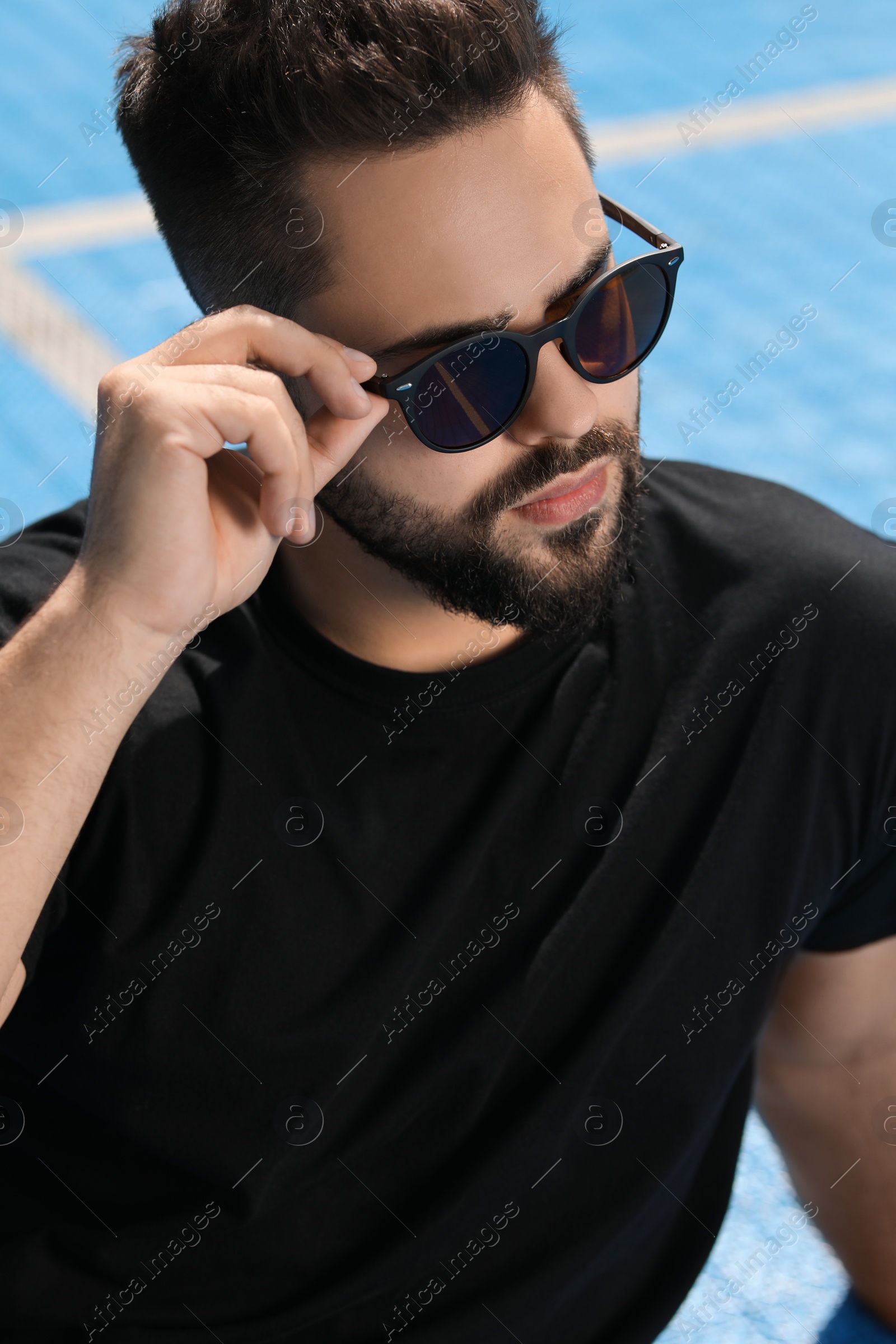 Photo of Handsome man in sunglasses outdoors on sunny day