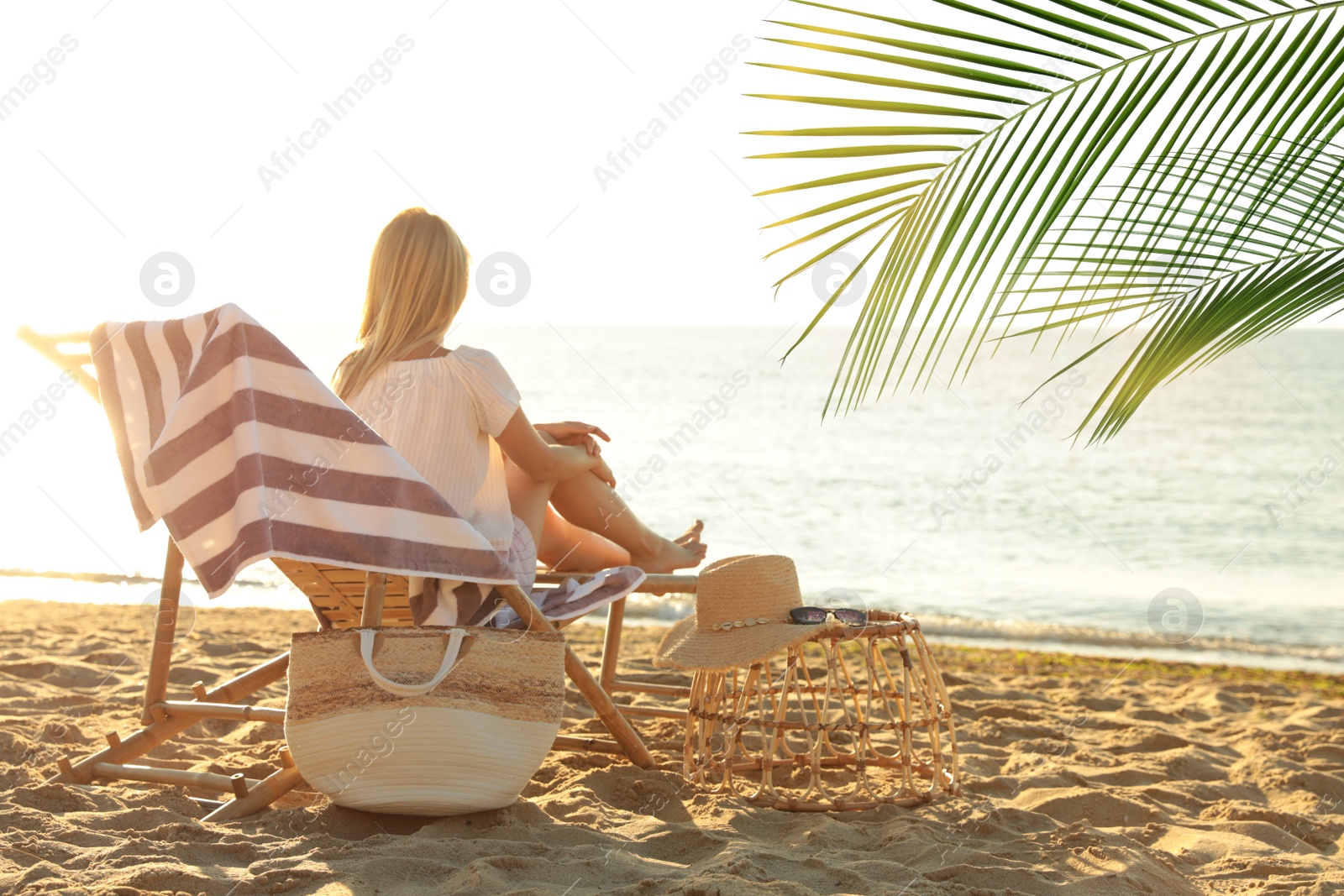 Image of Woman enjoying her summer vacation on sandy beach