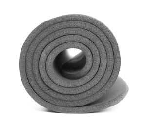 Photo of Rolled grey yoga mat on white background