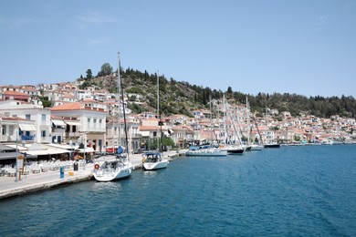 Photo of Beautiful view of coastal city with boats on sunny day