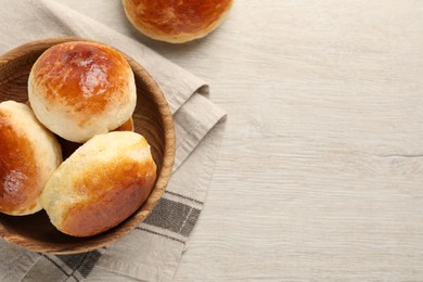 Photo of Freshly baked soda water scones on white wooden table, flat lay and space for text