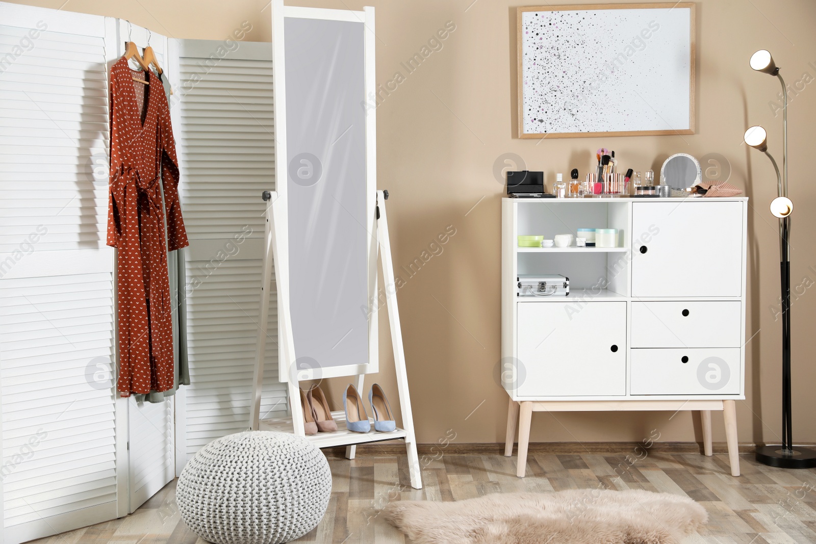 Photo of Interior of beautiful room with dressing table near wall