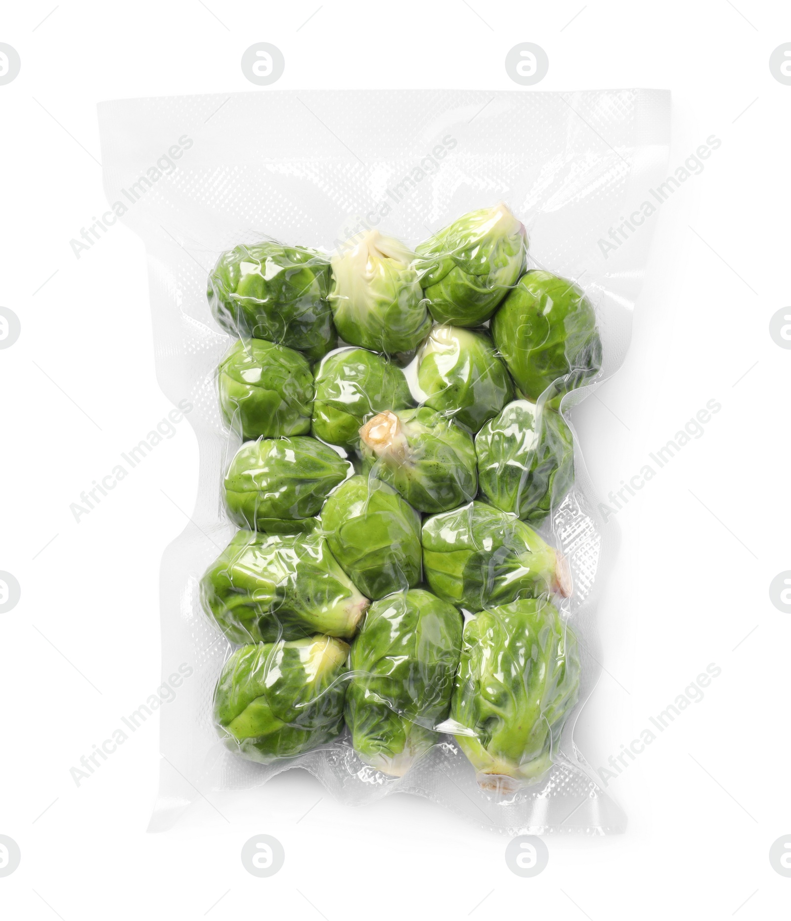 Photo of Vacuum pack of Brussels sprouts isolated on white, top view