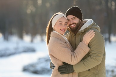 Beautiful young couple enjoying winter day outdoors